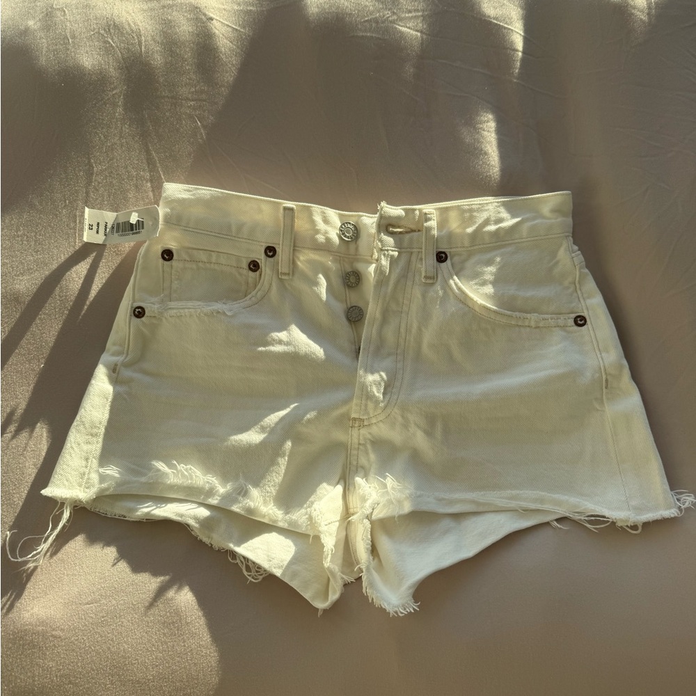 High-Rise Cream Denim Cutoff Shorts with Button Fly